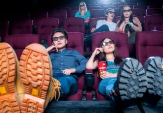 People in the cinema wearing 3d glasses