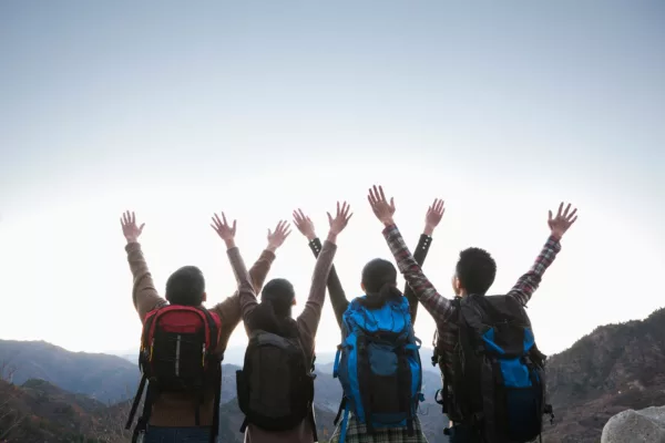 Group Of People Standing With Hands Outstretched