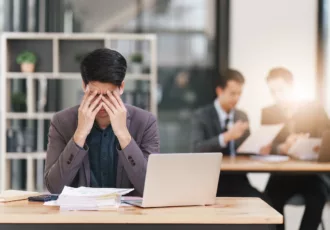 Stressed Business Person Working And Research Strategy On Laptop And Looking Worried, Tired, Finance, Teamwork, Big Data Graphs Charts Concept